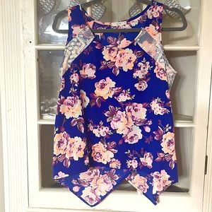 Floral tank with lace accents and crisscross back.